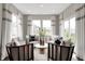 Bright sitting area featuring stylish chairs, a round center table, and ample natural light through large windows at 7523 Fallsworth Dr, Avon, IN 46123