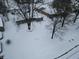 An aerial view of a snow-covered neighborhood showcases cozy homes at 7816 E St Joseph St, Indianapolis, IN 46219