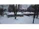 An aerial view of a snow-covered neighborhood showcases cozy homes at 7816 E St Joseph St, Indianapolis, IN 46219