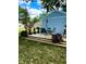 Landscaped backyard featuring a raised deck and an outdoor dining area at 7816 E St Joseph St, Indianapolis, IN 46219