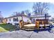 Inviting backyard deck with wooden stairs and railing, offering a great space for outdoor gatherings and relaxation at 7816 E St Joseph St, Indianapolis, IN 46219