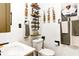 Stylish bathroom featuring floating shelves, modern fixtures, and decorative elements at 7816 E St Joseph St, Indianapolis, IN 46219