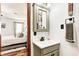 Chic bathroom sink and mirror with decorative fixtures, set in a soothing color scheme at 7816 E St Joseph St, Indianapolis, IN 46219