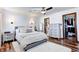 Bright bedroom with a ceiling fan, soft carpet, and a glimpse into the large closet at 7816 E St Joseph St, Indianapolis, IN 46219