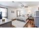 Spacious bedroom with a ceiling fan, soft carpet, large bed, and a cozy ambiance at 7816 E St Joseph St, Indianapolis, IN 46219