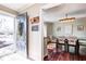 Welcoming entryway provides a peek into the elegant dining room with hardwood floors at 7816 E St Joseph St, Indianapolis, IN 46219