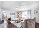 Cozy living room featuring comfortable seating, hardwood floors, and lots of natural light at 7816 E St Joseph St, Indianapolis, IN 46219