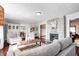 Inviting living room boasts a fireplace, hardwood floors and seamlessly connects to other living areas at 7816 E St Joseph St, Indianapolis, IN 46219