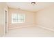 Bright bedroom with large window and neutral color palette at 8015 Heyward Dr, Indianapolis, IN 46250