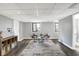 Serene sitting area with modern chairs, a stylish rug, and lots of natural light at 8211 Taunton Rd, Indianapolis, IN 46260