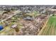 Wide aerial shot of the property highlighting the ponds, rural landscape, and proximity to the town at 905 S Maple St, Fortville, IN 46040