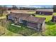 Aerial shot of the home showing the garage, spacious yard, and well-maintained exterior at 905 S Maple St, Fortville, IN 46040