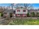 Charming two-story home featuring well-maintained landscaping and a brick front facade at 905 S Maple St, Fortville, IN 46040