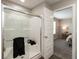 Modern bathroom with a glass-enclosed shower and a view to the bedroom at 9709 Tampico Chase, Fishers, IN 46040