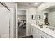 Well-lit bathroom featuring double vanity sinks and a view to the bedroom at 9709 Tampico Chase, Fishers, IN 46040