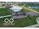 Aerial view of community pool, playground, and pond at 9709 Tampico Chase, Fishers, IN 46040