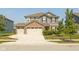 Beautiful two-story home with a well-manicured lawn, a three-car garage, and a brick-and-siding facade at 9709 Tampico Chase, Fishers, IN 46040