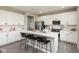 Spacious kitchen with white cabinets, stainless steel appliances, and a large center island at 9709 Tampico Chase, Fishers, IN 46040