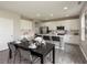 Bright kitchen with stainless steel appliances, a breakfast bar, and a dining table at 9709 Tampico Chase, Fishers, IN 46040