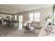 Open-concept living room with sofas, an adjacent dining area, and a modern kitchen at 9709 Tampico Chase, Fishers, IN 46040