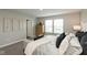 Comfortable main bedroom with neutral decor, a large window, and stylish furnishings at 9709 Tampico Chase, Fishers, IN 46040