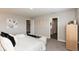 Spacious main bedroom with decorative wall art, a view to the ensuite bathroom, and a sitting area at 9709 Tampico Chase, Fishers, IN 46040