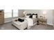 Serene main bedroom with neutral tones, a comfortable seating area, and ample natural light at 9709 Tampico Chase, Fishers, IN 46040
