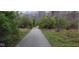 Discover nature along winding trails surrounded by serene woodlands and foliage at 9709 Tampico Chase, Fishers, IN 46040