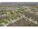 An aerial view of homes in a suburban neighborhood with ponds and landscaping at 10145 Northwind Dr, Indianapolis, IN 46256