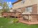 Wooden deck with a grill and view of the green yard at 10145 Northwind Dr, Indianapolis, IN 46256