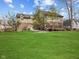 Large backyard with a wooden deck and grassy area at 10145 Northwind Dr, Indianapolis, IN 46256