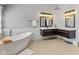 A contemporary bathroom offers a soaking tub and a dual sink vanity at 10145 Northwind Dr, Indianapolis, IN 46256