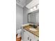 Tastefully decorated powder room with white vanity and granite countertop at 10145 Northwind Dr, Indianapolis, IN 46256