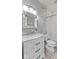 Bathroom with white marble vanity, brushed nickel hardware, tiled shower and gray walls at 10145 Northwind Dr, Indianapolis, IN 46256