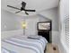 Bedroom featuring a ceiling fan, window with blinds, and a TV at 10145 Northwind Dr, Indianapolis, IN 46256