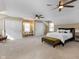 Bright, spacious bedroom with ceiling fans, two closets, and seating at 10145 Northwind Dr, Indianapolis, IN 46256