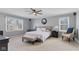 Spacious bedroom with neutral colors, ceiling fan and two windows for ample natural light at 10145 Northwind Dr, Indianapolis, IN 46256