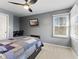 A comfortable bedroom features natural light and a desk at 10145 Northwind Dr, Indianapolis, IN 46256