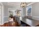 Stylish dining room with a long table and chairs, opening into the living room at 10145 Northwind Dr, Indianapolis, IN 46256