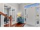 Inviting foyer with hardwood floors and a charming blue console table at 10145 Northwind Dr, Indianapolis, IN 46256