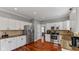 Bright kitchen featuring white cabinets, stainless steel appliances, and granite countertops at 10145 Northwind Dr, Indianapolis, IN 46256