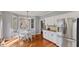 Cozy eat-in kitchen with stainless steel refrigerator, white cabinetry, and views of backyard at 10145 Northwind Dr, Indianapolis, IN 46256