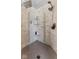 The shower offers luxurious features like custom tile work, built-in shelving, and dual shower heads at 10145 Northwind Dr, Indianapolis, IN 46256