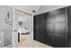 A walk-in closet boasts ample storage and connects seamlessly to the serene main bedroom at 10145 Northwind Dr, Indianapolis, IN 46256