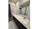 Bathroom featuring marble-style walls, dual sinks, and white quartz countertops at 10950 N Heirloom Dr, Monrovia, IN 46157