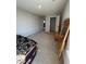 Bedroom with neutral carpet, light gray walls, and doorway to closet and other rooms at 10950 N Heirloom Dr, Monrovia, IN 46157