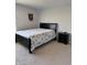 Bedroom has a queen size bed with carpeted floors and LED lights on the ceiling at 10950 N Heirloom Dr, Monrovia, IN 46157