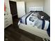 Cozy bedroom featuring a comfortable bed with blue and white patterned bedding and modern furniture at 10950 N Heirloom Dr, Monrovia, IN 46157