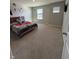 Bright bedroom has two windows that let in a lot of light with a teddy bear on the bed at 10950 N Heirloom Dr, Monrovia, IN 46157