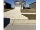 Two story home boasts vinyl siding, stone accents, two car garage, and a long concrete driveway at 10950 N Heirloom Dr, Monrovia, IN 46157